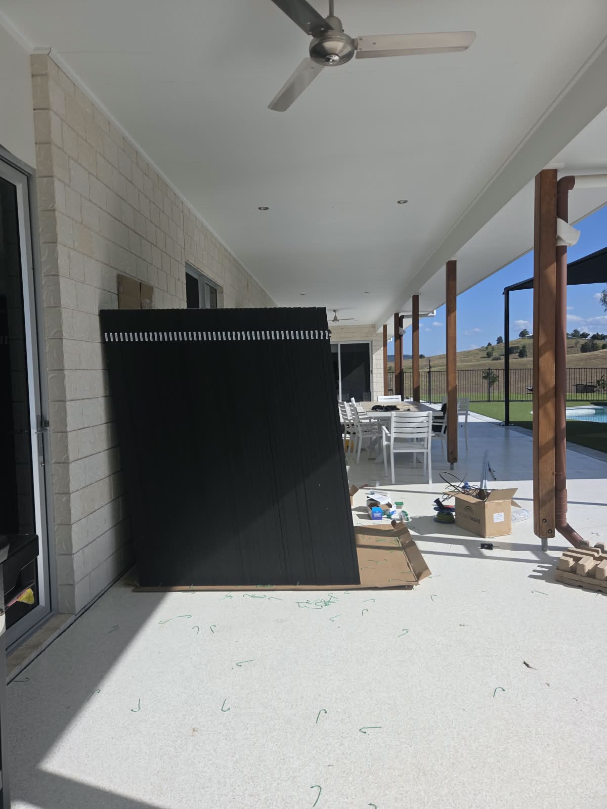 Logan Village panels staged on patio before install Untapped Energy